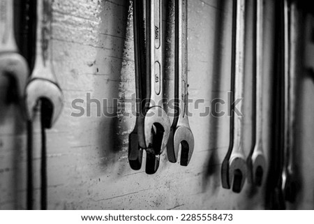 Selective focus. Board with work tools. Wrench. Board full of spanners of different sizes. Tools of a mechanical workshop. copy space