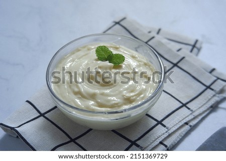 selective focus of a bowl of diplomat cream against white background