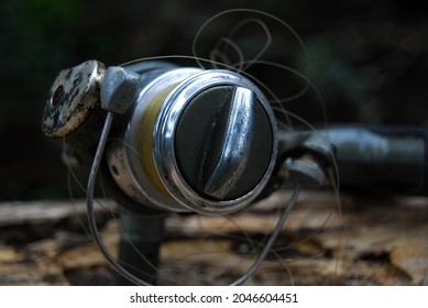 selective focus of broken fishing rod on a wooden block - Powered by Shutterstock