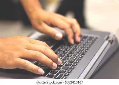 Selective focus Business man using laptop computer. Male hand typing on laptop keyboard . Administrator working in data center configure and check internet network on computer laptop