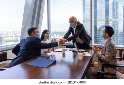 Selective Focus, Business People Wearing Face Mask, Successful And Congratulation Brainstorming Ideas For Investment In Office During Coronavirus, Or COVID 19 Outbreak.