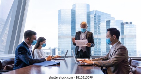 Selective Focus, Business People Wearing Face Mask, Meeting, Discussing, Brainstorming Ideas For Investment In Office During Coronavirus, Or COVID 19 Outbreak.