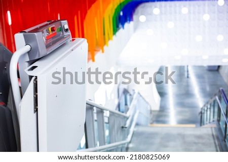 Selective focus to button switch panel of electric stairs for transporting disabled people in subway stations in Bangkok Thailand.