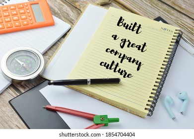 Selective Focus Of Calculator, Compass, Pen, Math Geometry, Earphones, Paper Holding File And Notebook Written With Text BUILT A GREAT COMPANY CULTURE. Business Concept. 