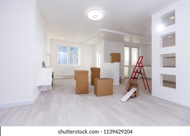 Selective focus of cardboard boxes in empty kitchen during relocation