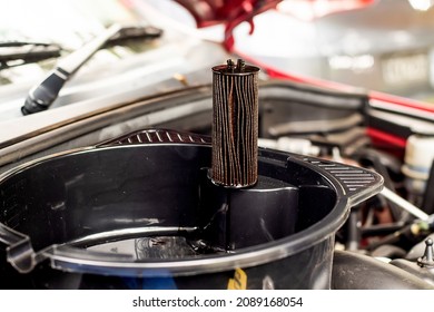 Selective Focus. Changing Car Oil Filter. DIY Change Engine Motor Oil. At Home Vehicle Maintenance. Oil Filter Replacement. Old Used Oil Filter