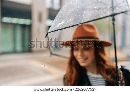 Similar – Blonde thin woman with hat and sunglasses visiting the city during the day.