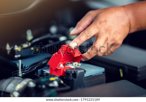 Selective focus\
to check and maintenance the battery in car with yourself. Service\
and maintenance car or\
vehicle.