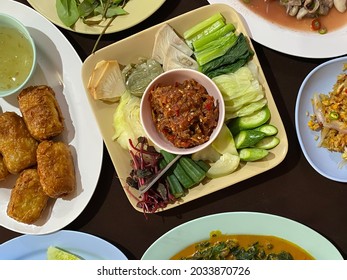 Selective Focus Of Chili Paste With Shrimp Served With Fried Rice, Spicy Oyster Salad, Deep Fried Crab Spring Roll And Cockles With Betel Leaves Curry