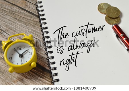 Selective focus of clock, pen, coins and notebook written with text THE CUSTOMER IS ALWAYS RIGHT. Business concept.