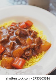 Selective focus close up of beef curry on yellow basmati rice