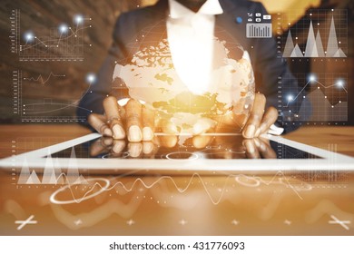 Selective focus. Close up of black man's hands holding digital tablet with reflective touchscreen surface, using high-speed Internet connection while relaxing at the student's cafe after classes