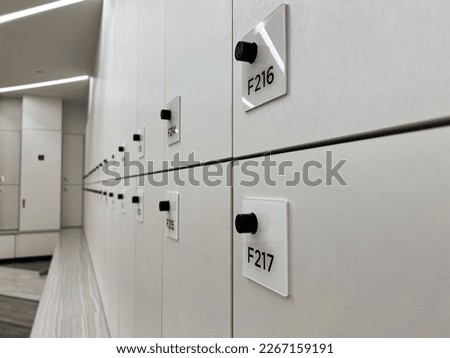 Selective focus close up minimal white locker in the gym for personal belongings