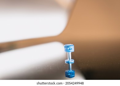 Selective Focus. Close Up Photo Of A Bleu Tool For The Car Is Used For Paintless Dent Removal After The Hail Damage To The Vehicle.