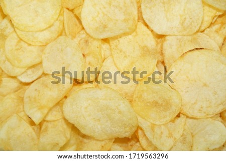 Selective focus Close up potato chips on wood top view background.