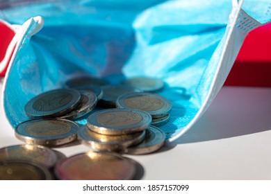 Selective Focus Of Coins Coming Out Of A Health Mask In Health Expenditure And Public Health