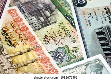Selective focus for a collection of old Egyptian money banknotes, Leftover Egyptian pounds currency non circulating anymore,  20, 10 and 5 Pounds with 50, 25, 10 and 5 piasters, vintage retro.