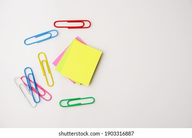 Selective focus of colorful sticky notes and paper clips. Flat lay, top view. Copy space.  - Shutterstock ID 1903316887