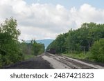 Selective focus copy space train tracks and fuel tanker train industrial background image
