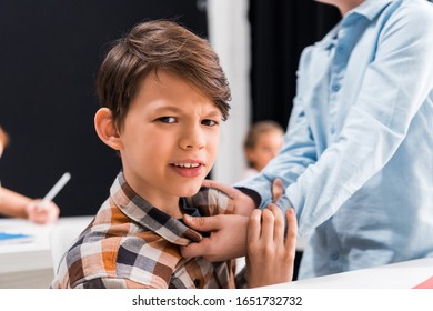 Selective Focus Of Cruel Schoolkid Bullying Scared Schoolboy