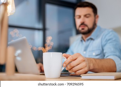 Selective focus of a cup with tea