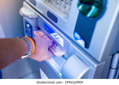 Selective Focus To Customer Withdraw Money From ATM Machine. Baht Cash Withdrawal From ATM.