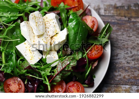 Similar – Mediterranean lunch or dinner with roasted dorado fishes, homemade focaccia bread , olive oil and olives served on rustic table with tableware and kitchen utensils, top view.