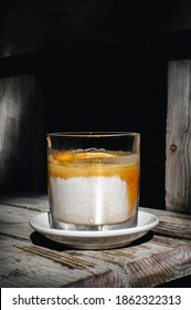 Selective Focus Dirty Coffee In A Glass On A Wooden Table