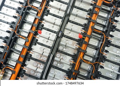 Selective focus of Electric car lithium battery pack and wiring connections internal between cells on background.