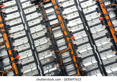 Selective focus of Electric car lithium battery pack and wiring connections internal between cells on background