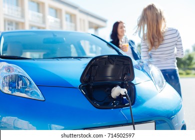 Selective focus of an electric charger plugged into the car