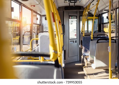 selective focus of empty city bus interior with seats