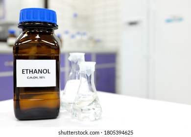 Selective Focus Of Ethanol Or Ethyl Alcohol In Brown Glass Bottle Inside A Laboratory.