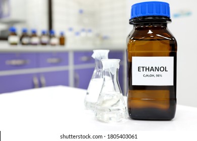 Selective Focus Of Ethanol Or Ethyl Alcohol In Brown Glass Bottle Inside A Laboratory.