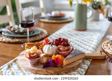 Selective Focus Fall Charcuterie Board On A Dining Room Table