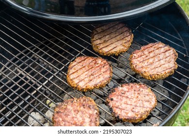 Selective Focus Of Fresh Delicious Burger Cutlets Grilling On Bbq Grill