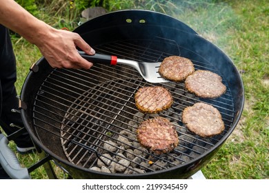 Selective Focus Of Fresh Delicious Burger Cutlets Grilling On Bbq Grill