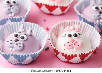 Selective Focus Funny Cupcakes Shaped Cat On Pink Cake Turntable. Close Up.