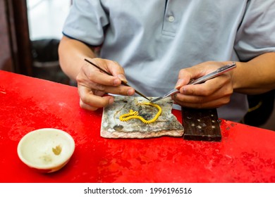 Selective Focus To The Goldsmith Is Preparing For The Repair Of Gold Jewelry Using Solder.