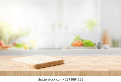 Selective focus.End grain wood counter top with cutting board on blur kitchen in morning window background.For montage product display or design key visual - Powered by Shutterstock