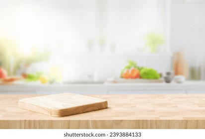 Selective focus.End grain wood counter top with cutting board on blur kitchen in morning window background.For montage product display or design key visual