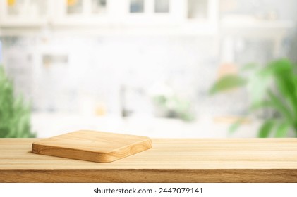 Selective focus.End grain wood counter top with cutting board on blur kitchen background.For montage product display or design key visual - Powered by Shutterstock