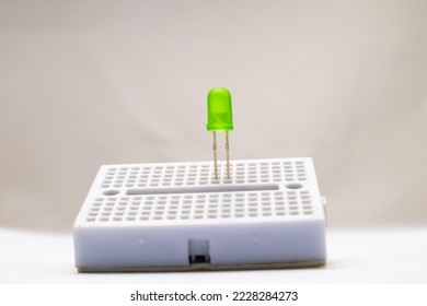 Selective focus from a green LED embedded in the project board. This part is used by electronics hobbyists for DIY materials.