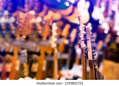 Selective Focus To Guitar Tuning Knob With Many Guitar Background In Musical Showroom At Musical Store. Instrument Concept. Studio Shop.