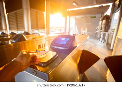 Selective Focus To Hand Of Passenger Using Smart Card To Open Automatic Gate Machine At Sky Train Station. Modern Automatic Ticket. Access Control Passenger Of Transportation Concept.