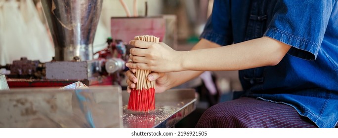 Selective Focus. Hand Worker Indigenous Working Make Dried Incense Stick Product With Machine. Southeast Asia Culture And Tourism. Incense Sticks SME Business. Selective Focus.