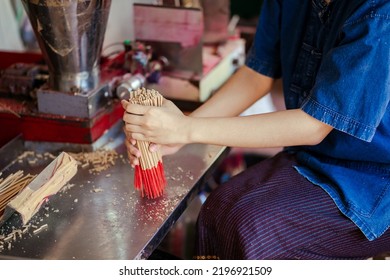 Selective Focus. Hand Worker Indigenous Working Make Dried Incense Stick Product With Machine. Southeast Asia Culture And Tourism. Incense Sticks SME Business.