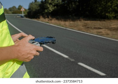Selective focus, hands of a man operating a drone