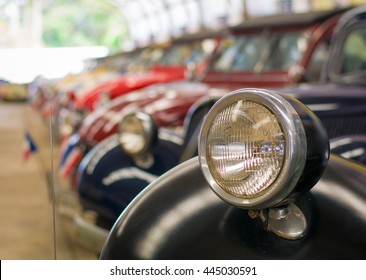 Selective focus headlight lamp vintage car in a row, copy space. - Powered by Shutterstock