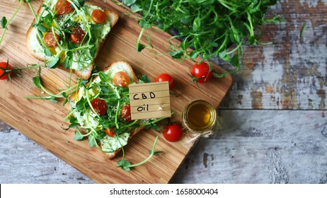 Selective Focus. Healthy Toasts With Microgreens And Cbd Oil. Cannabidiol Concept. CBD Oil. Cbd Food.